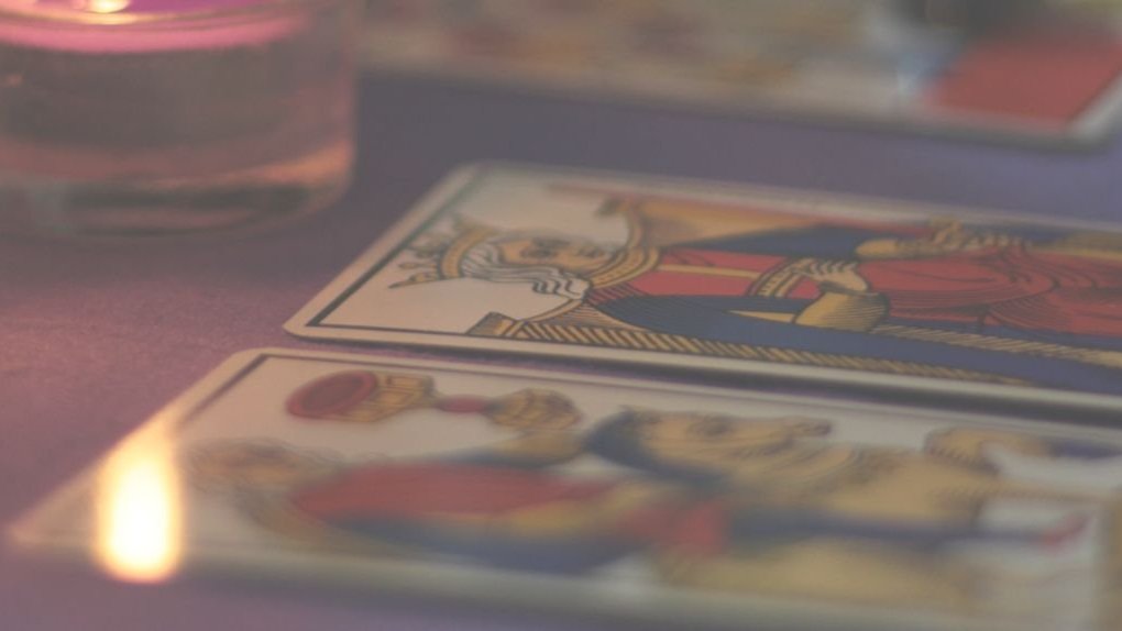 a stone building on a small island with water a stone building on a small island with water