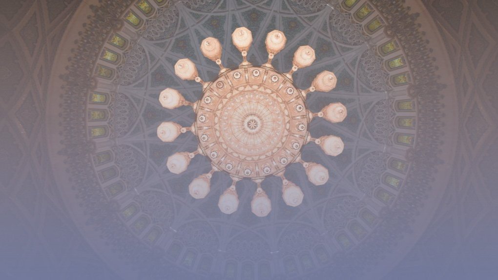 a stone building on a small island with water a stone building on a small island with water